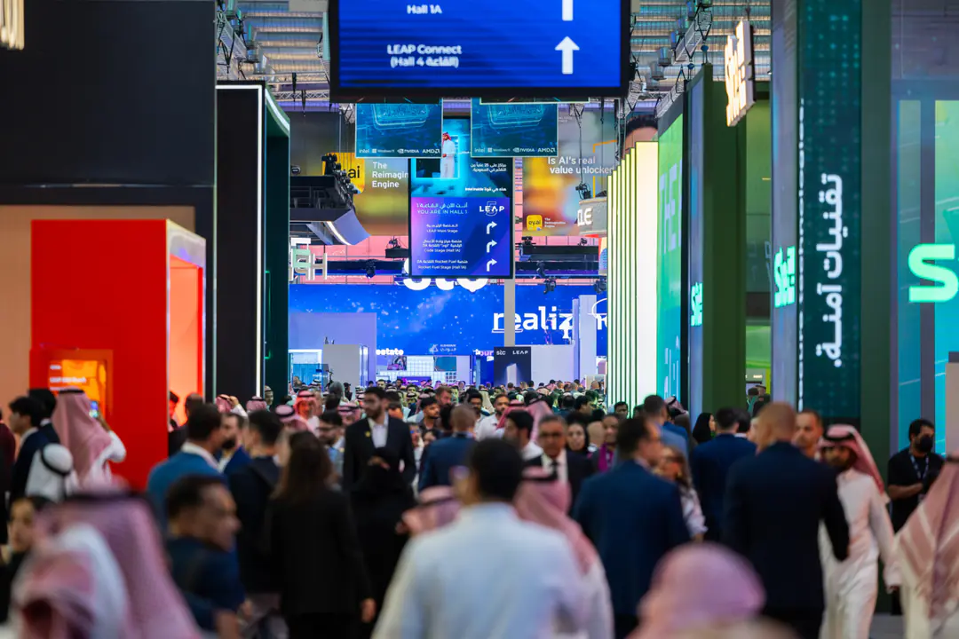 Busy technology and business event floor representing market access and growth