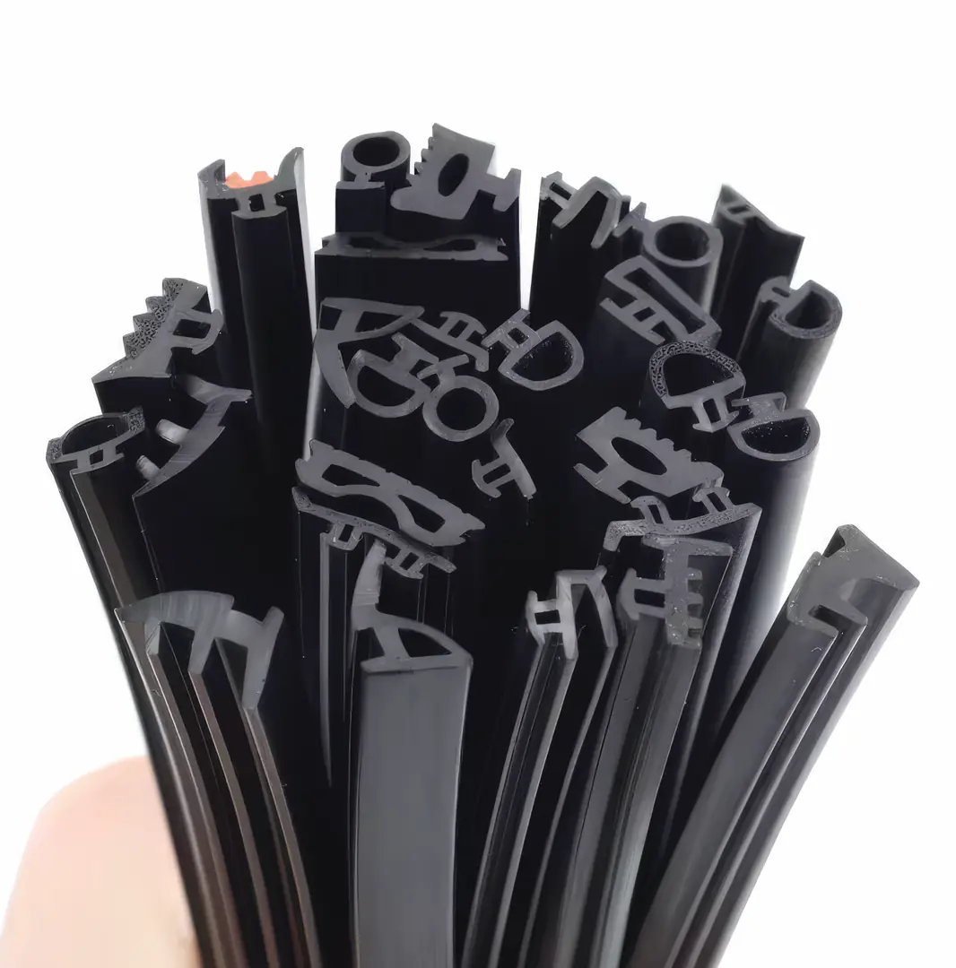 Collection of black extruded rubber and plastic profiles shown in cross-section